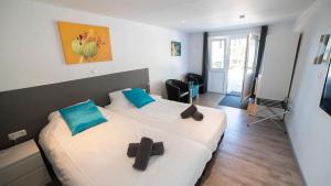 a bedroom with two beds in a room at De Heek in Valkenburg