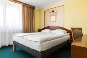 Posteľ alebo postele v izbe v ubytovaní Hotel Wersal
