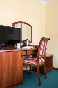 Televízia a/alebo spoločenská miestnosť v ubytovaní Hotel Wersal