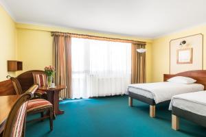 Posteľ alebo postele v izbe v ubytovaní Hotel Wersal