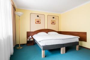 Posteľ alebo postele v izbe v ubytovaní Hotel Wersal