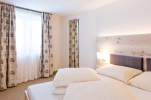 Una cama o camas en una habitación de Hotel Cervo