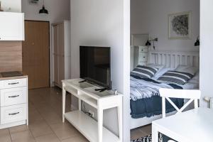 TV a/nebo společenská místnost v ubytování Apartamenty w Świnoujściu