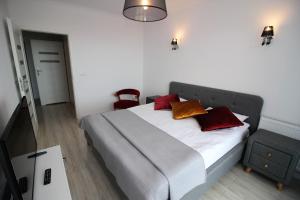 Łóżko lub łóżka w pokoju w obiekcie Apartamenty Kropla Bałtyku