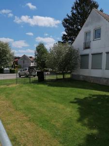 a white house with a yard in front of it at FEWO-ATLANTA Reinhardshausen in Reinhardshausen