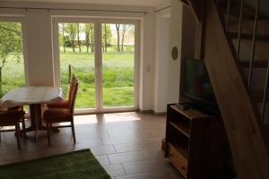 TV a/nebo společenská místnost v ubytování Ferienhaus Groß Popkenhausen