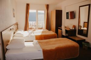 Ένα ή περισσότερα κρεβάτια σε δωμάτιο στο Hotel Villa Matic +76 φωτογραφίες