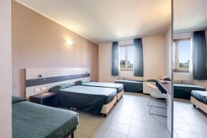 Postel nebo postele na pokoji v ubytování Hotel Alba Roma