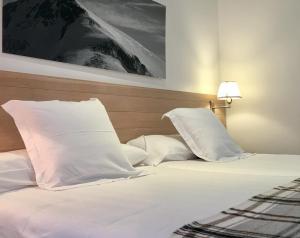 Säng eller sängar i ett rum på Hotel Valdecoro