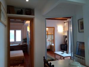 a room with a bedroom and a living room at Barca Serena in Port de la Selva