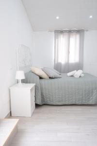 A bed or beds in a room at Le Volte - Locazione Turistica