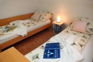 Postel nebo postele na pokoji v ubytování La Marea Portoroz