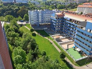 an aerial view of a building with a park at Apartamento PATXIKE con plaza de garaje in Bermeo