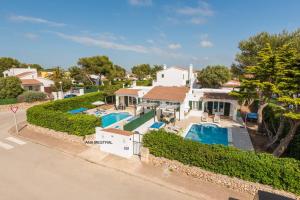 an aerial view of a house with a swimming pool at Villas Isi & Ana Mestral in Cala en Blanes