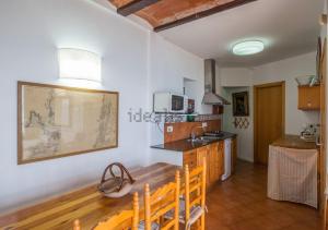 a kitchen with a sink and a counter top at Barca Serena in Port de la Selva