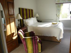 A bed or beds in a room at Pickmere Country House
