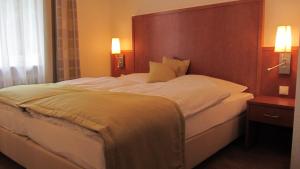 Postel nebo postele na pokoji v ubytování Hotel Walkner
