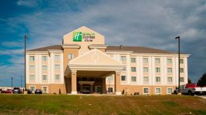a large building with a sign on the front of it at Holiday Inn Express & Suites Morrilton, an IHG Hotel in Morrilton