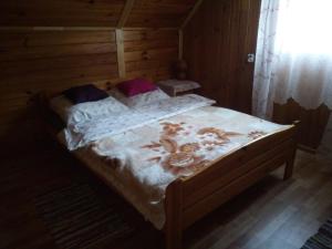 Posteľ alebo postele v izbe v ubytovaní Domek Jancio Wodnik