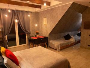 a hotel room with two beds and a table and a bed at Pokoje Alicja in Łeba
