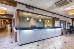 a lobby of a hotel with a counter in a room at Lamplighter Inn and Suites - North in Springfield