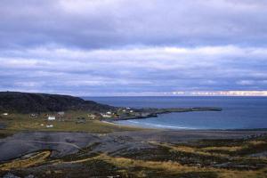 a view of a beach and the ocean on a cloudy day at Grandfathers house at the end of Europe, Varanger in Havningberg
