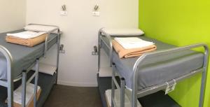 Postel nebo postele na pokoji v ubytování UBA Hostel