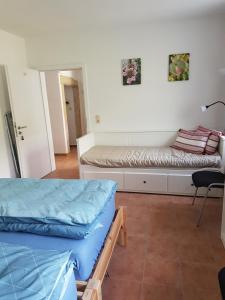 מיטה או מיטות בחדר ב-Haus Vogelgesang Pirna