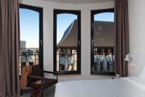 Postel nebo postele na pokoji v ubytování 9Hotel Central