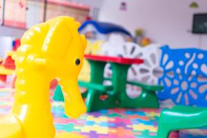a plastic toy duck in front of a play set at Hotel Vilage Inn All Inclusive Poços de Caldas By Nacional Inn in Poços de Caldas