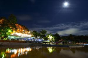 a view of a lit up building at night at Hotel Vilage Inn All Inclusive Poços de Caldas By Nacional Inn in Poços de Caldas
