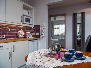 a kitchen with a table with a bowl on it at A fourteen in Kilkeel