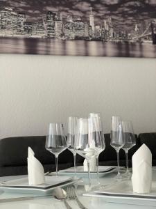 a table with wine glasses and napkins on it at Bella Luna in Überlingen