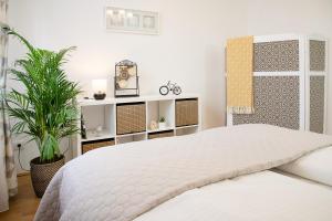 Voodi või voodid majutusasutuse Green Oasis apartment Vienna toas