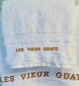 a white towel with the words its weekly crisis on it at Les Vieux Guays in Cerdon