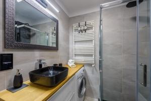 Kúpeľňa v ubytovaní Apartament Leśniczówka - 5D Apartamenty + 12 fotografií