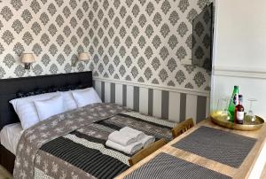 Posteľ alebo postele v izbe v ubytovaní VULTOR Apartments