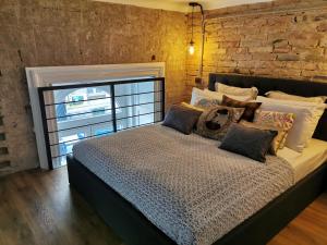 Posteľ alebo postele v izbe v ubytovaní The Address Loft 22ppl