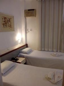 Posteľ alebo postele v izbe v ubytovaní Hotel Pampulha Palace
