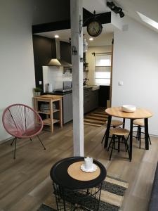 a kitchen and living room with a table and chairs at Studio apartman HANA in Drežnik Grad +24 photos