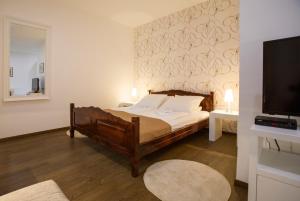 Postel nebo postele na pokoji v ubytování Garni Hotel Vila Drina