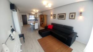A seating area at Aster Apartamento