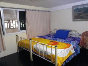 Letto o letti in una camera di Vanny's Peaceful Guesthouse