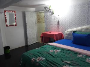 Letto o letti in una camera di Vanny's Peaceful Guesthouse