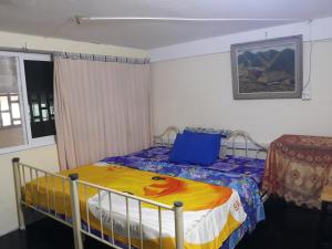 Letto o letti in una camera di Vanny's Peaceful Guesthouse
