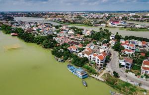 an aerial view of a town next to a river at Autumn Bay Retreat in Hoi An