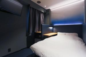 Postel nebo postele na pokoji v ubytování Hotel New Shohei