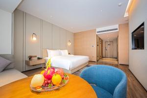 Voodi või voodid majutusasutuse Nanan Ao Sheng Yi Hao Hotel toas
