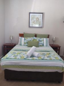 Ένα ή περισσότερα κρεβάτια σε δωμάτιο στο Lilacs Waterfront Villas & Cottages
