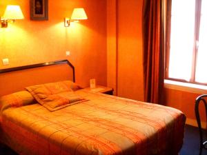 Кровать или кровати в номере Hôtel Beaunier